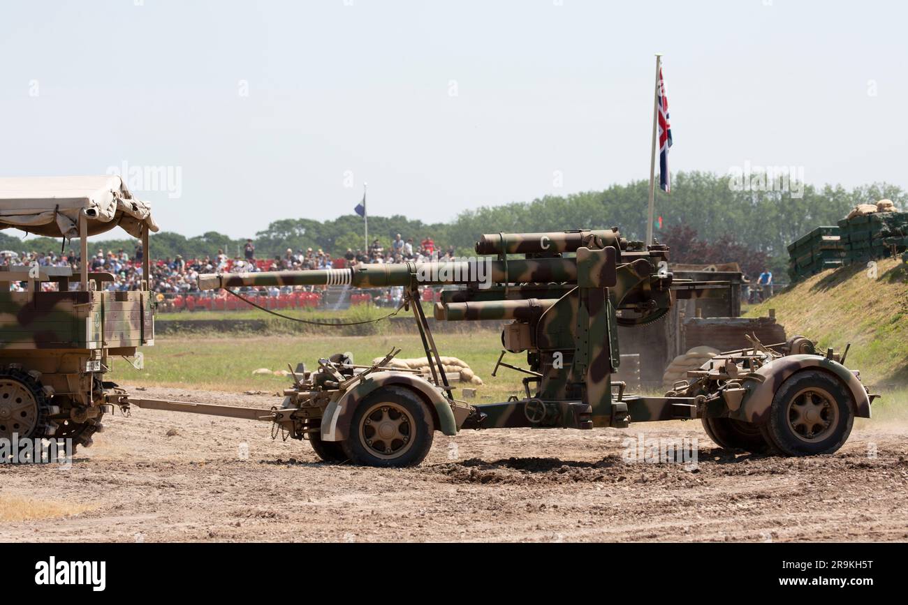 German Army Sd.Kfz. 7 8 tonne Prime Mover Half-track artillery tractor towing and 8.8 cm Flak gun, Tankfest 23, Bovington, UK Stock Photo