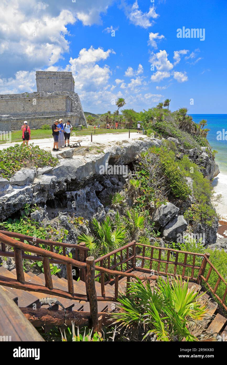 Tourists on the cliffs by El Castillo, the Castle, Tulum Ruins a Mayan archaeological site at Tulum National Park, Tulum, Quintana Roo, Mexico. Stock Photo