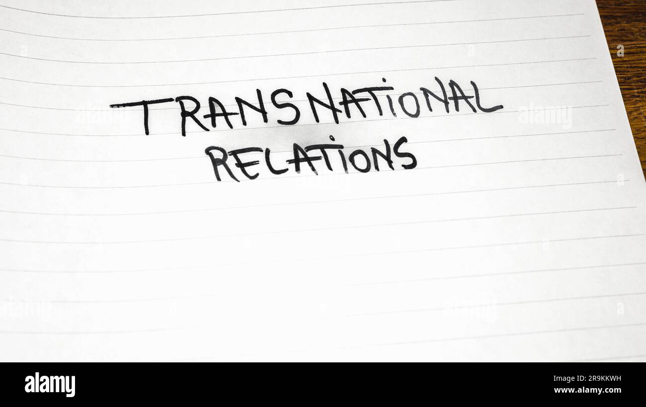 Transnational relations, handwriting  text on paper, political message. Political text on office agenda. Concept of democracy, voting, politics. Copy Stock Photo