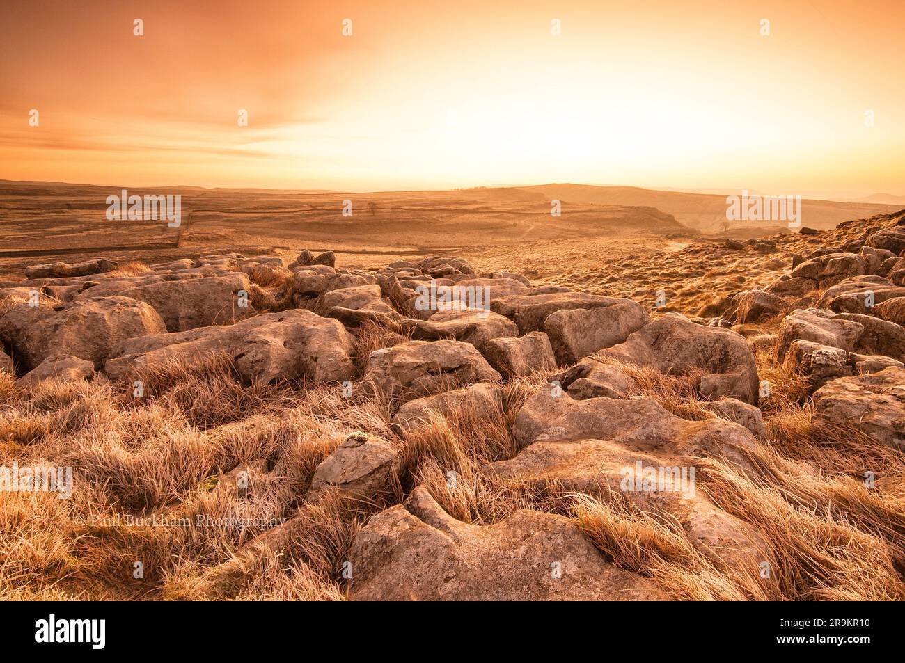 An epic and majestic sunset over a rugged and desolate landscape, isolated from civilization Stock Photo