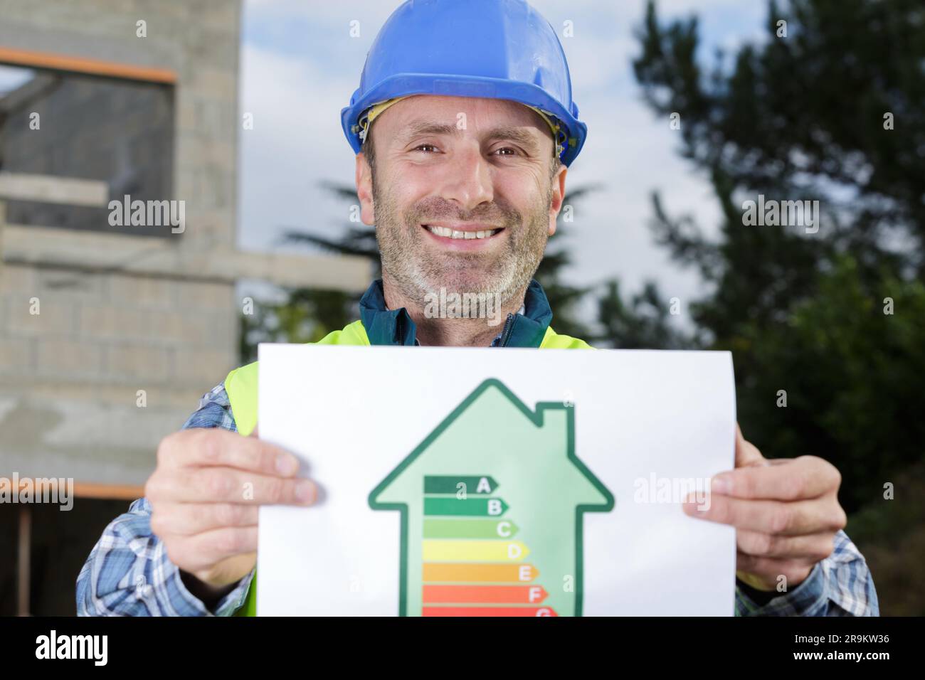 builder holding energy rating diagram for housing Stock Photo Alamy