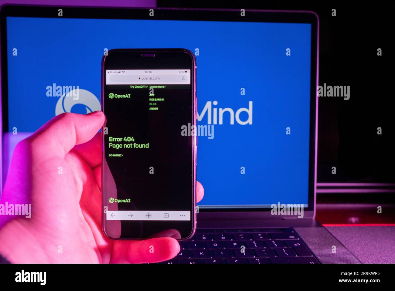 Azores, Portugal - 21.01.2023: SmartPhone Screen with OpenAI website erro 404, and in the Background blurred the AI Deep Mind Logo on a laptop. Stock Photo