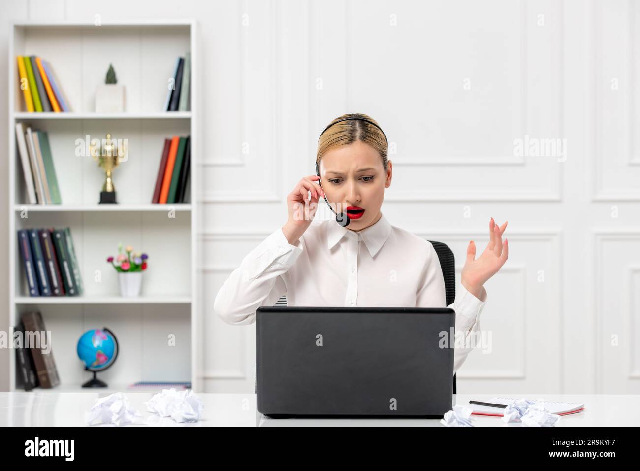 customer service cute blonde girl office shirt with headset and computer annoyed Stock Photo
