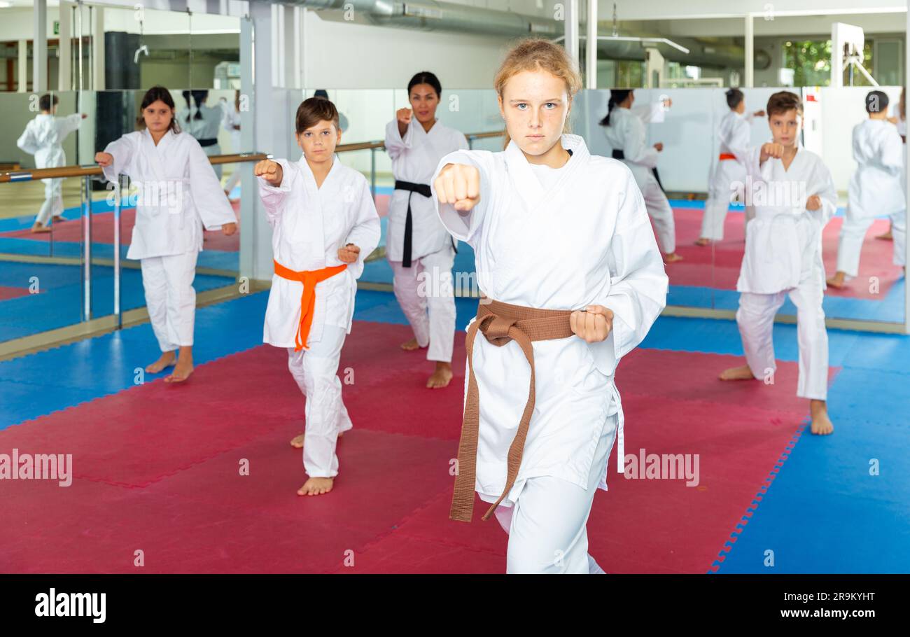 Karate kids doing kata in gym Stock Photo Alamy