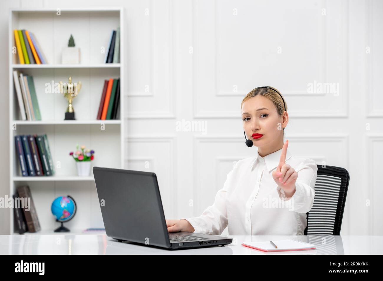 customer service cute blonde girl office shirt with headset and computer showing stop gesture Stock Photo