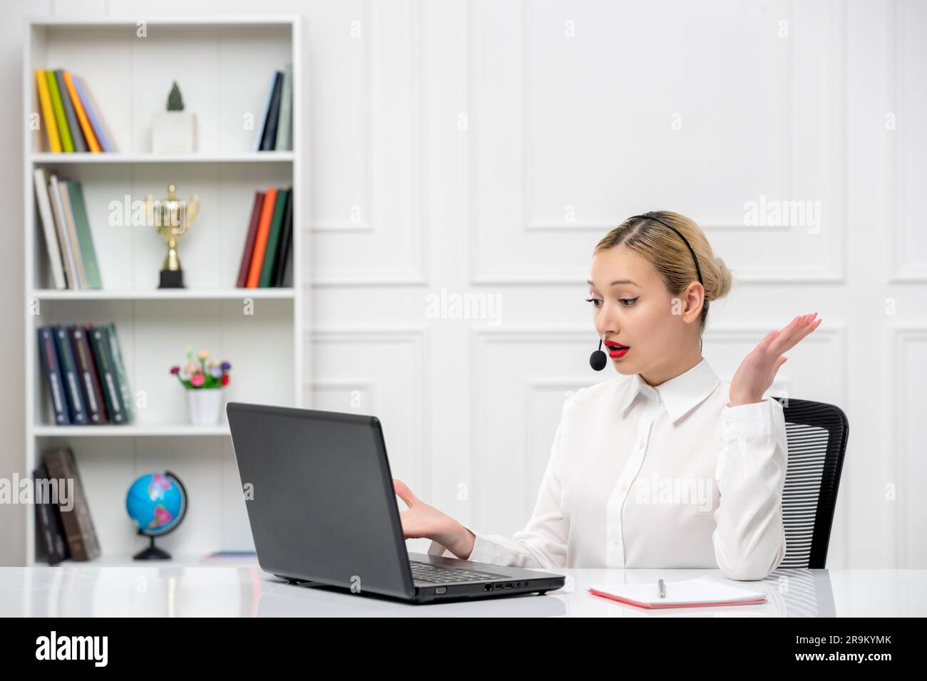 customer service cute blonde girl office shirt with headset and computer waving hands surprisingly Stock Photo