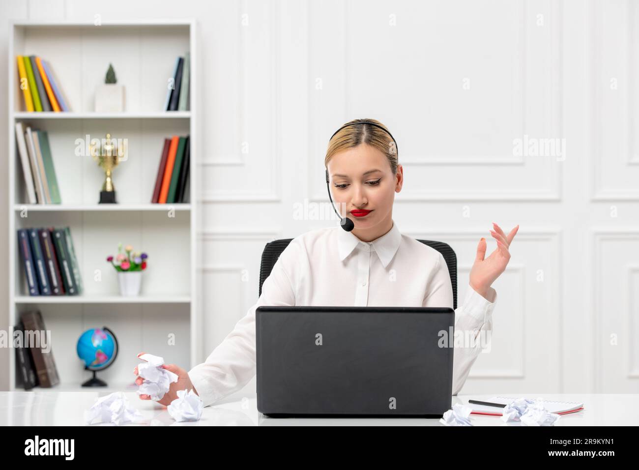 customer service cute blonde girl office shirt with headset and computer thinking Stock Photo