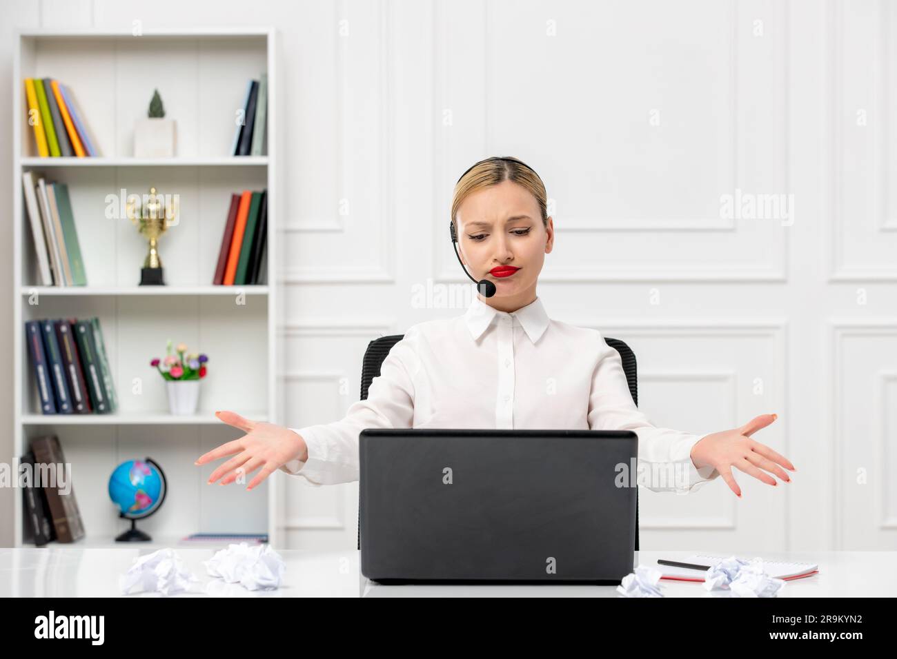 customer service cute blonde girl office shirt with headset and computer waving hands not happy Stock Photo
