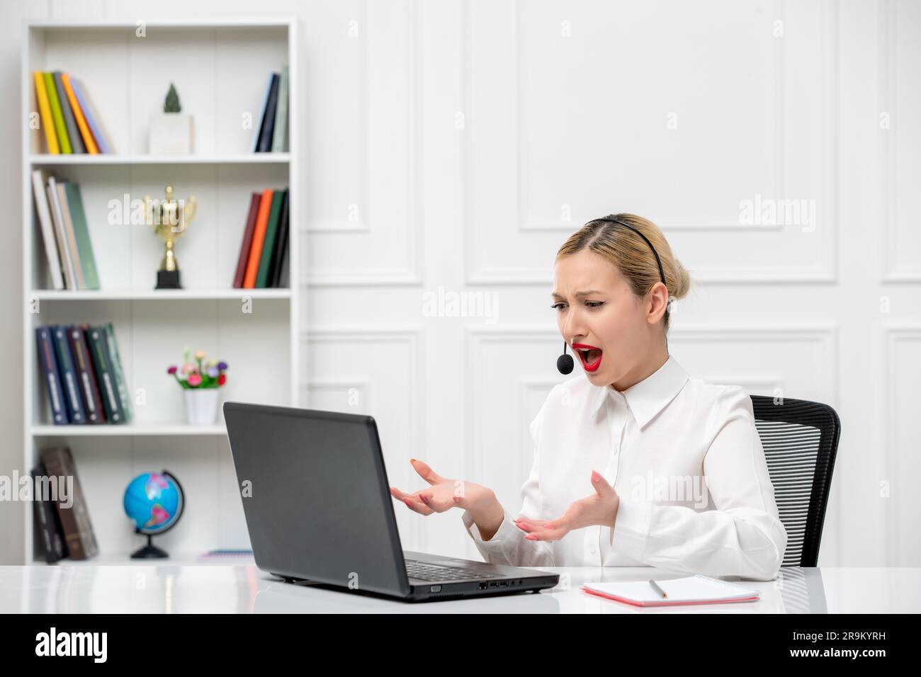customer service cute blonde girl office shirt with headset and computer yelling and angry Stock Photo