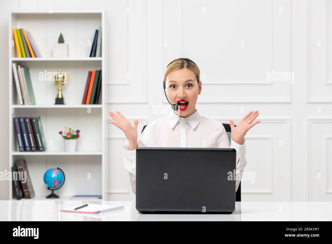 customer service cute woman in white shirt with headset and computer annoyed waving hands Stock Photo