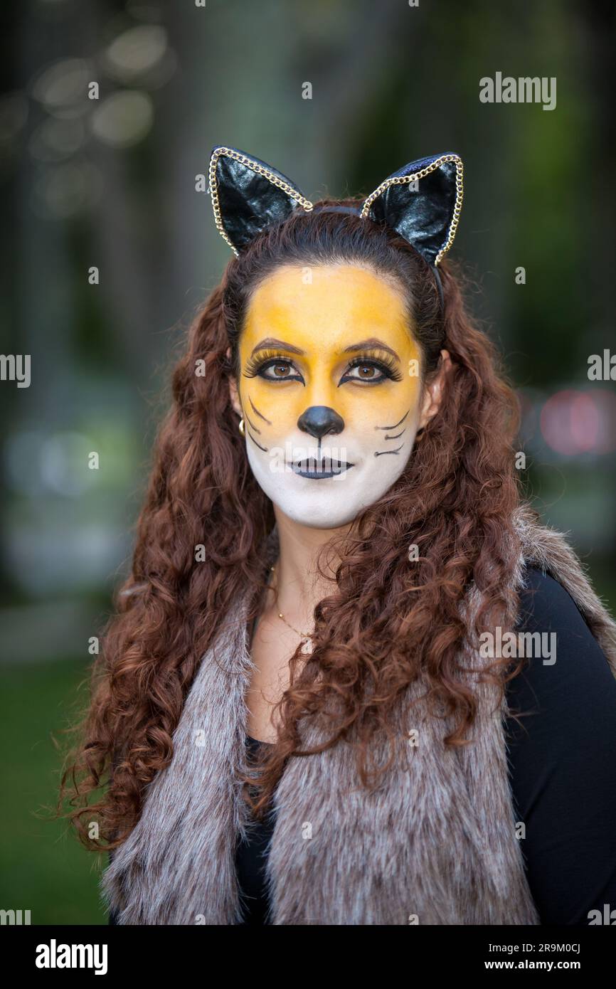 Beautiful young woman wearing a wolf costume. Real family having fun