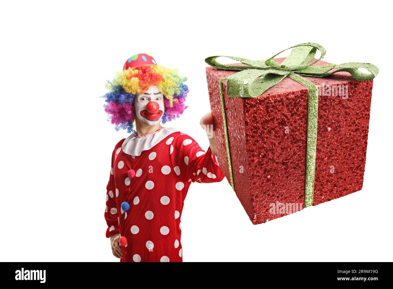 Happy male clown holding present hi-res stock photography and images ...