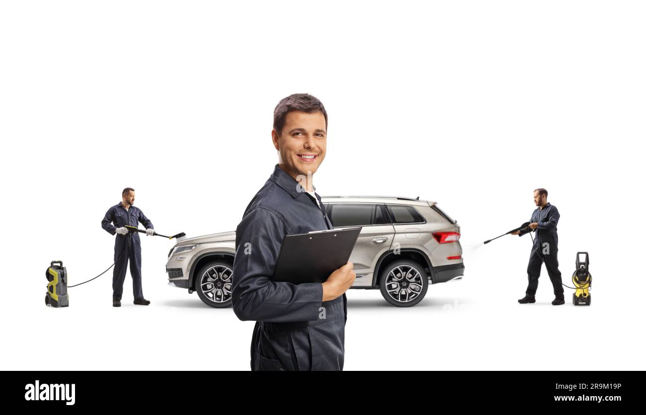 Car wash manager and workers washing a SUV with a pressure washer
