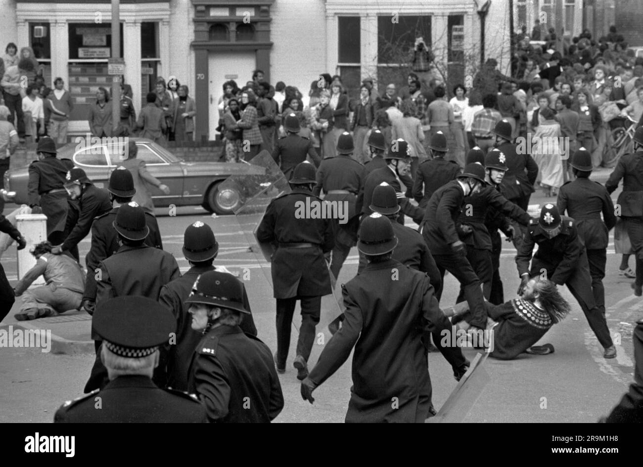 Racism 1970s UK. Anti Nazi League demonstration against a march by the National Front through the centre of Leicester. Police and Anti Nazi League demonstrators in a running skirmish. Leicester, England circa 1978. HOMER SYKES Stock Photo