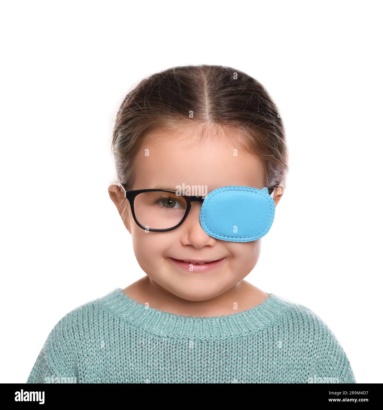 Happy girl with nozzle on glasses for treatment of strabismus against