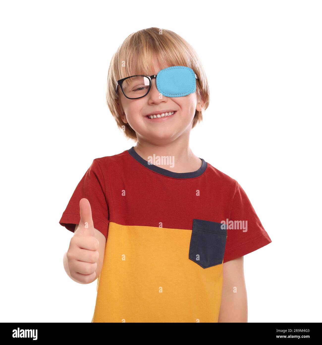 Happy boy with nozzle on glasses for treatment of strabismus showing