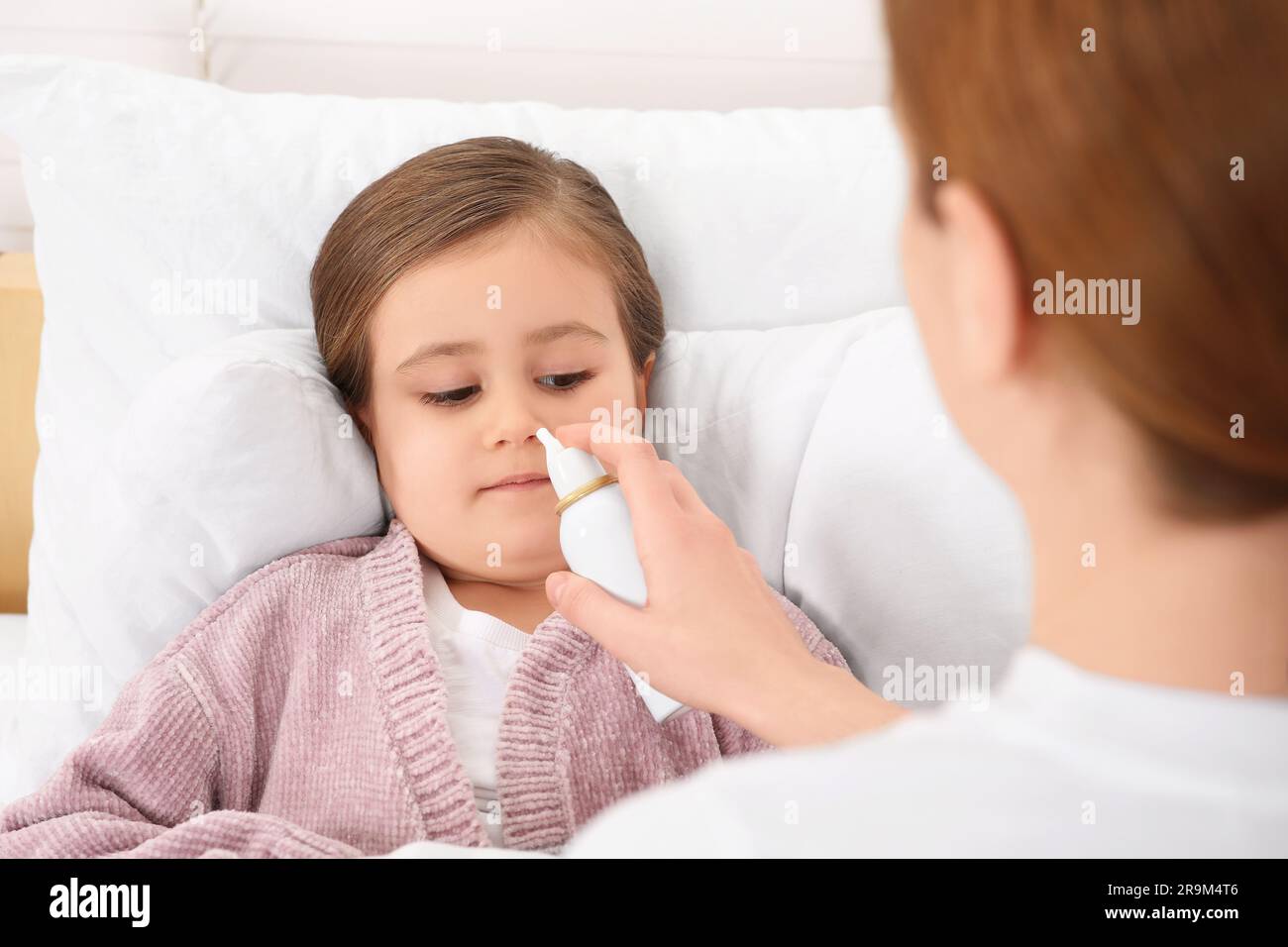 Child using nose spray hi-res stock photography and images - Alamy