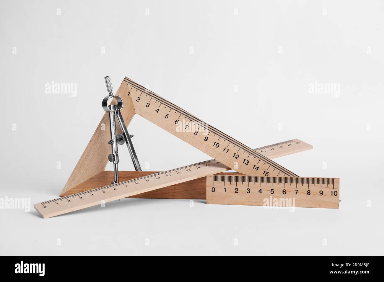 Different rulers and compass on white background Stock Photo - Alamy