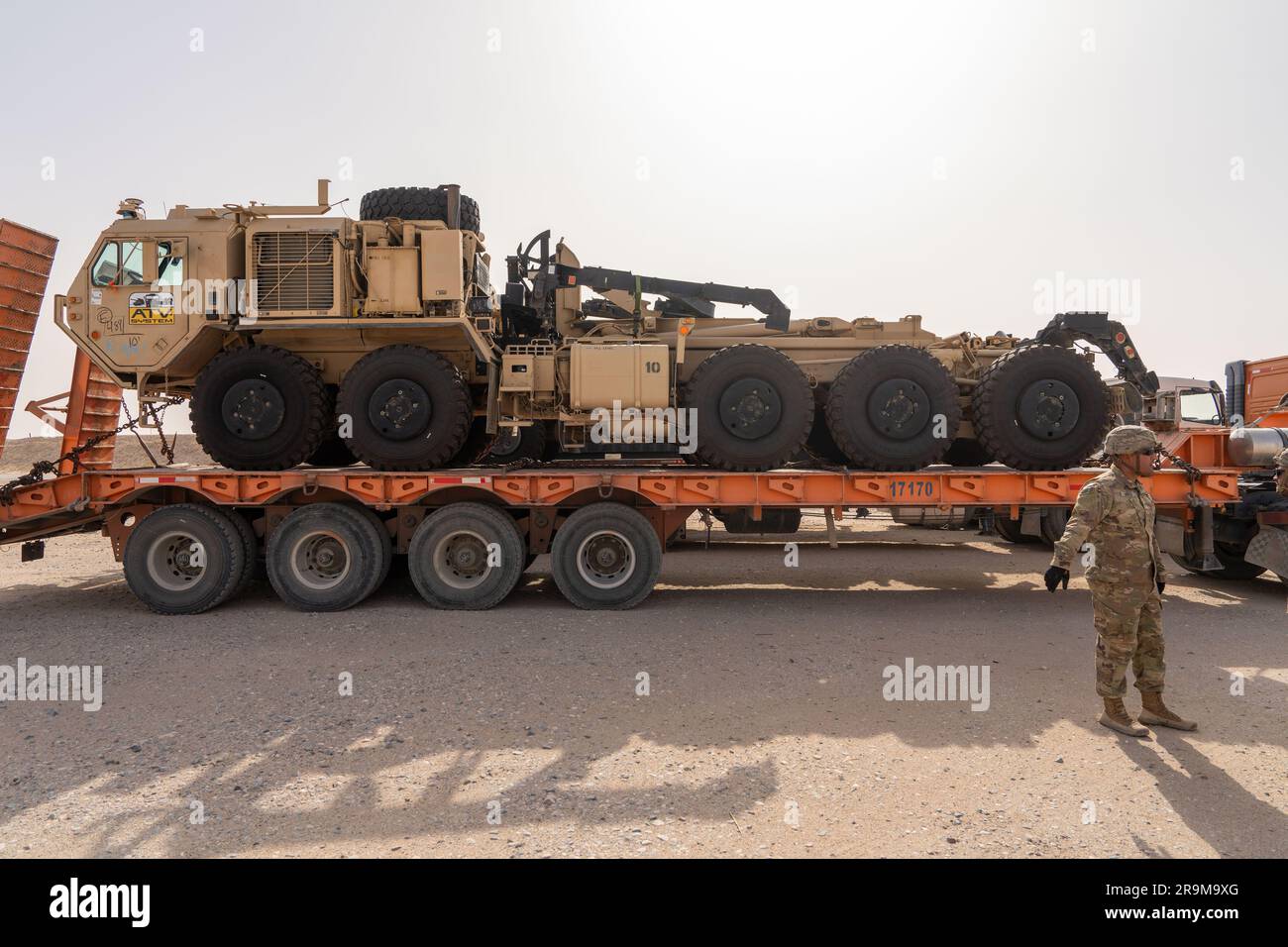 U.S. Army autonomous vehicle, palletized load system, is unloaded by Soldiers assigned to Charlie Company 142nd Division Sustainment Support Battalion, Task Force Legion, at Camp Buehring in Kuwait on June 26, 2023. The U.S. Central Command and U.S. Army Central are leading the way in innovation with autonomous vehicles, enabling the integration of emerging technologies. Task Force Legion is the name of the 382nd Combat Sustainment Support Battalion, in theater, under the 369th Sustainment  Brigade, Task Force Hellfighter. (U.S. Army National Guard video by Staff Sgt. Sebastian Rothwyn) Stock Photo