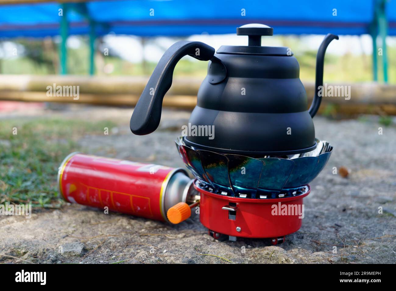 Black Drip kettle on portable stove for camping. Park and outdoor photography. Stock Photo