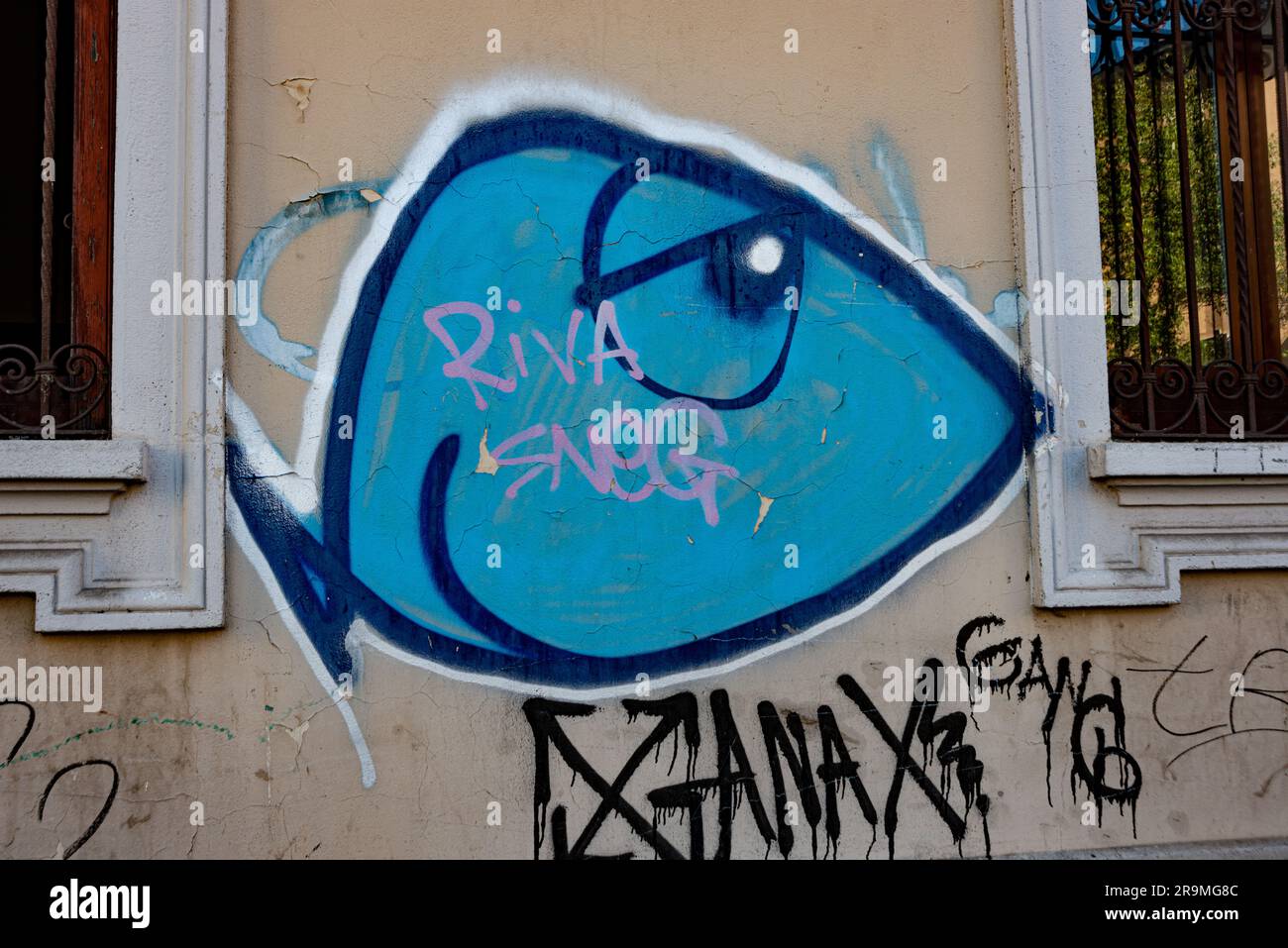 Milan graffiti street art. Fish like character Stock Photo