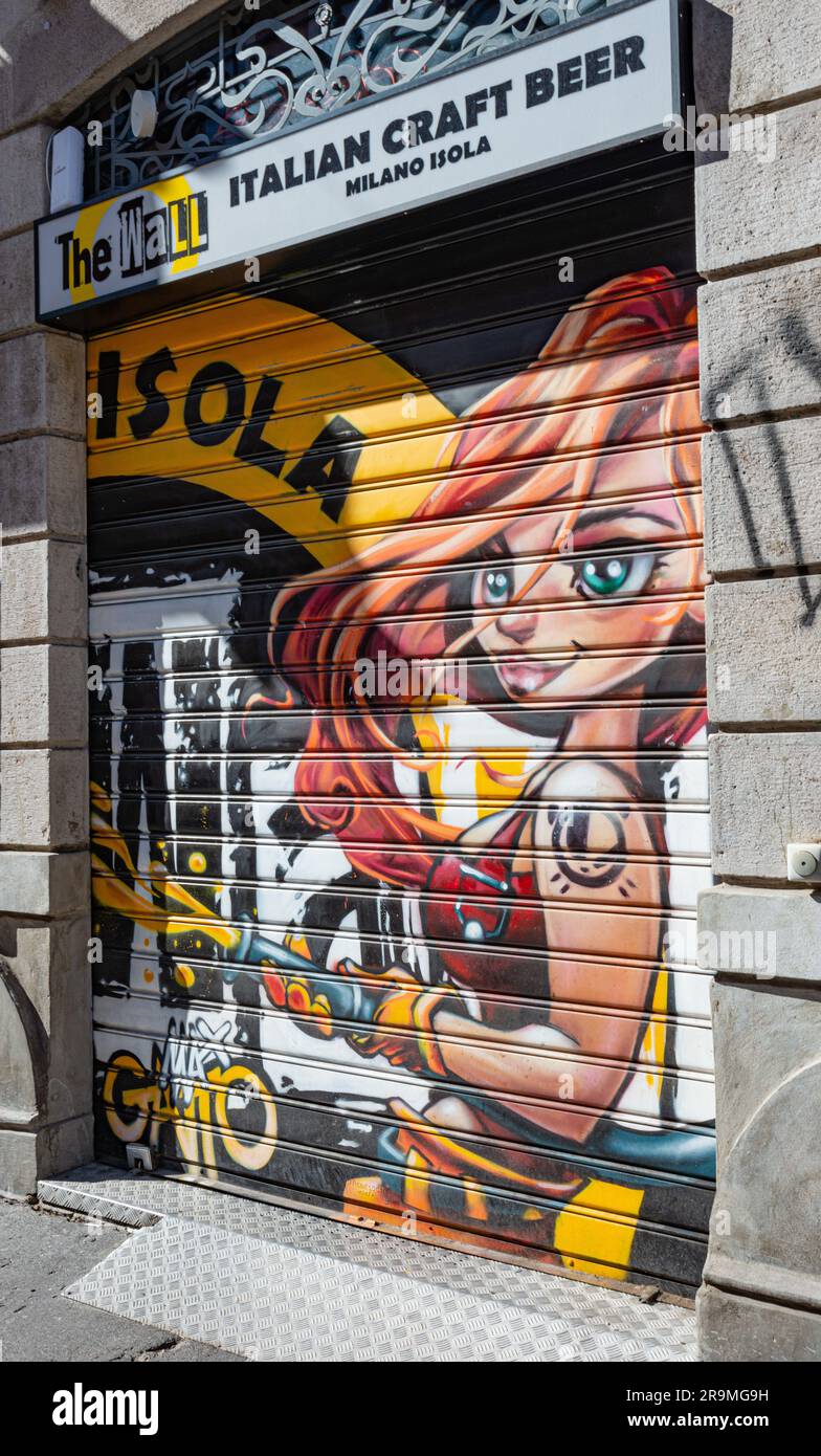 Artwork on the shutter of The Wall Italian Craft beer in Milan Isola district Stock Photo