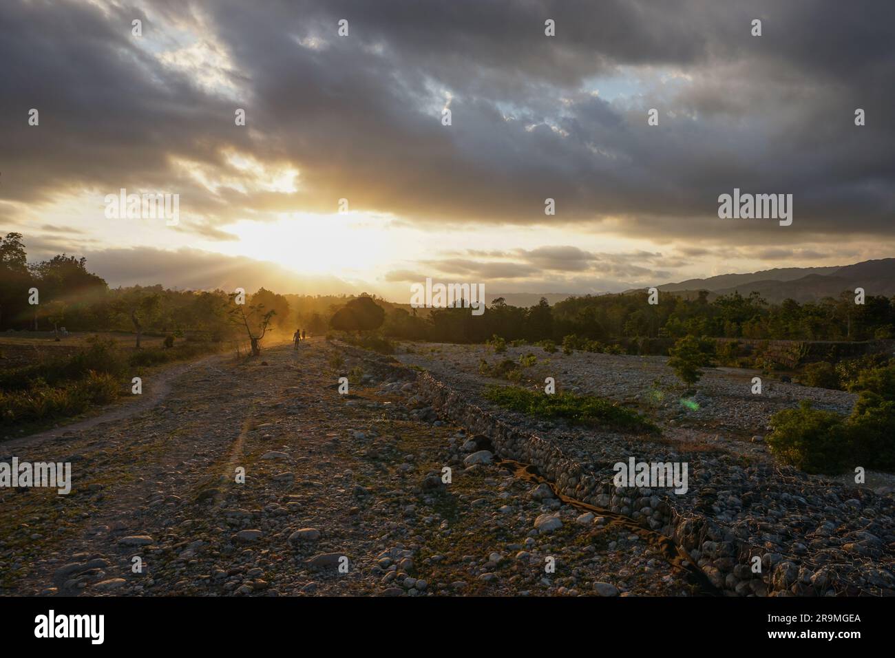 The sun sets over Cavaillon River in Maniche, Haiti on March 30, 2023. (Rose Hurguelle Point du Jour/Global Press Journal) Stock Photo
