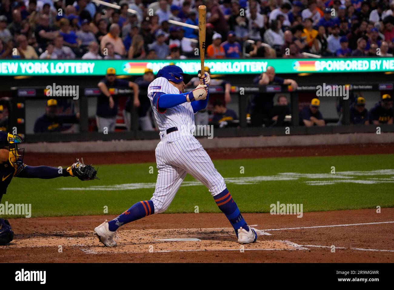 FLUSHING, NY - JUNE 27: New York Mets Center Fielder Brandon Nimmo (9) hits  a home run during the fourth inning of a Major League Baseball game between  the Milwaukee Brewers and