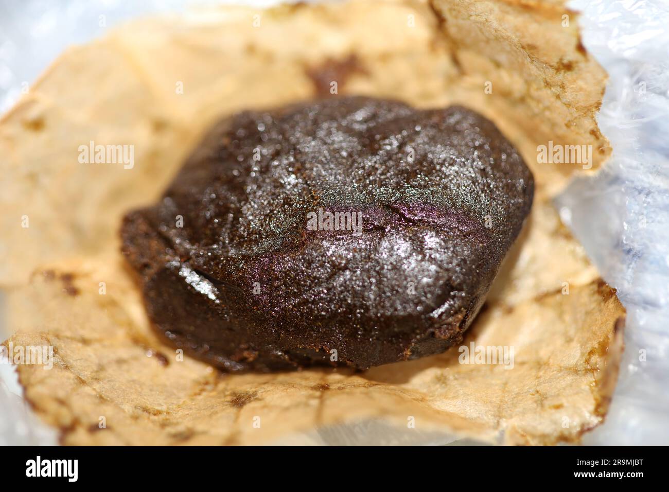 Detail of medical marijuana nepalese high thc brown charas close up bio cannabis resin hashish in Nepal extraction dry hash pollen big size amazing qu Stock Photo