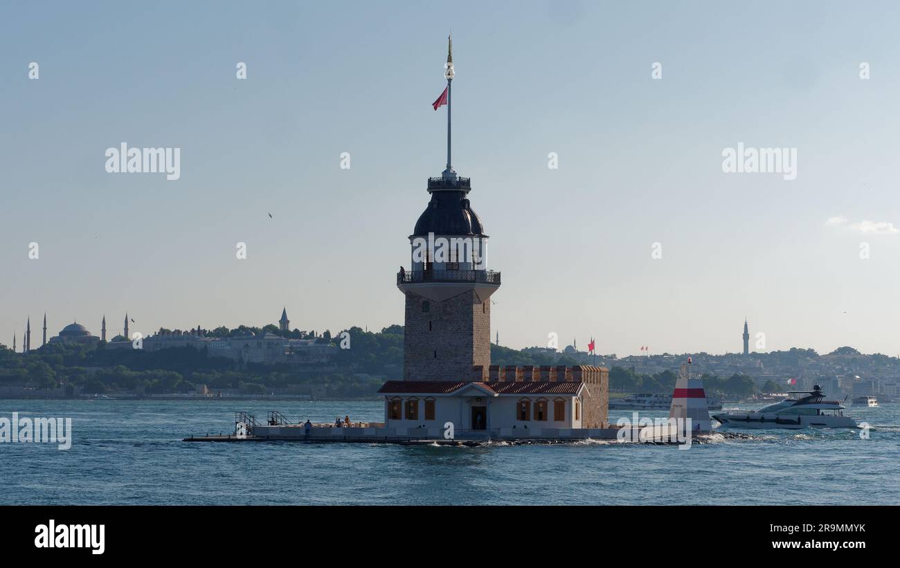 Maidens Tower on the Bosporus aka Bosphorus Sea in Istanbul Turkey. Behind on the European side is the Topkapi Palace and Hagia Sophia. Stock Photo