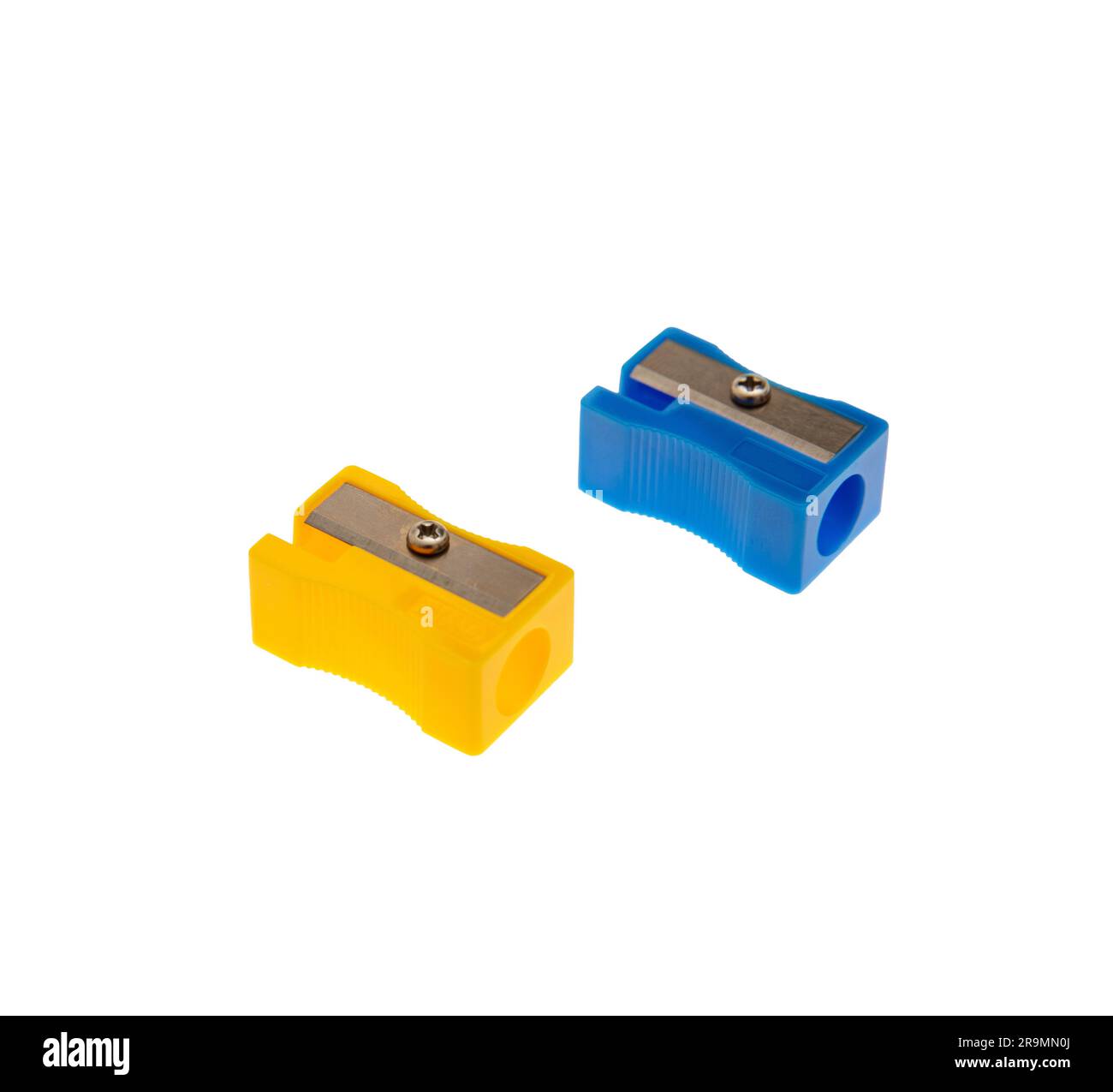 Blue and yellow pencil sharpeners isolated on white, closeup, School