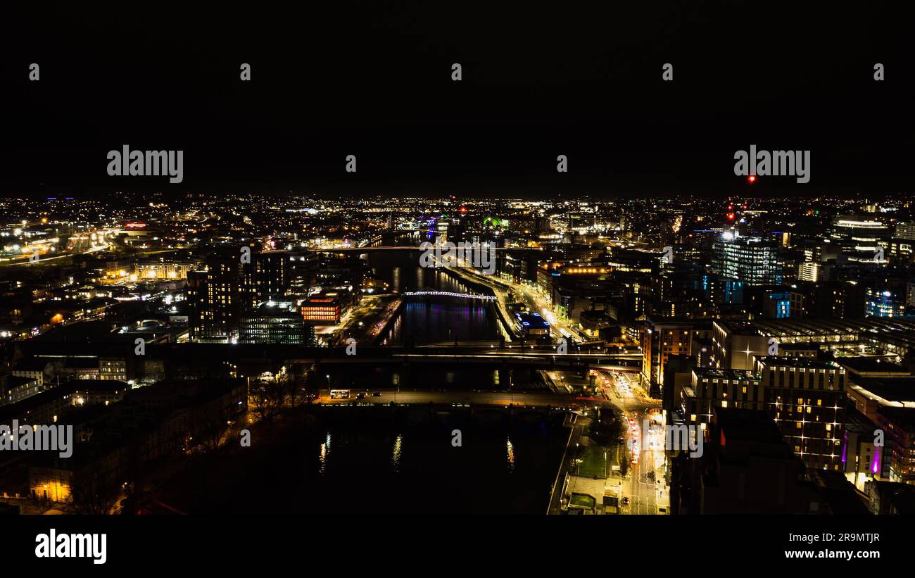 An aerial view of Glasgow, Scotland, at night with brightly lit ...