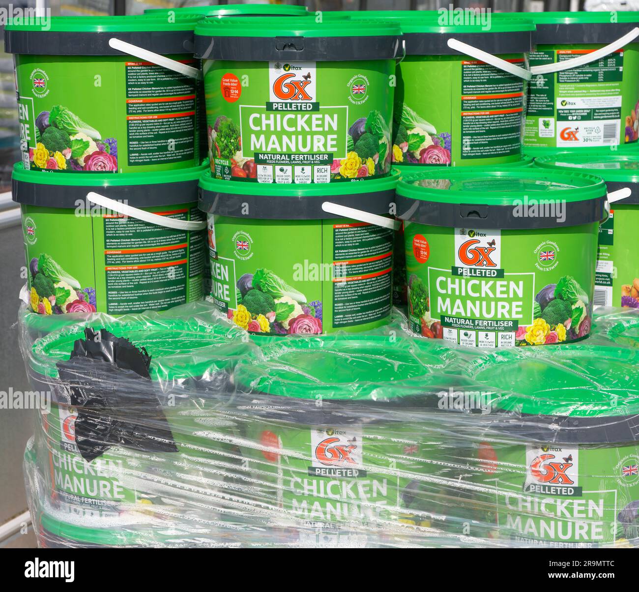 Plastic tubs of Vitax pelleted chicken manure natural fertiliser at