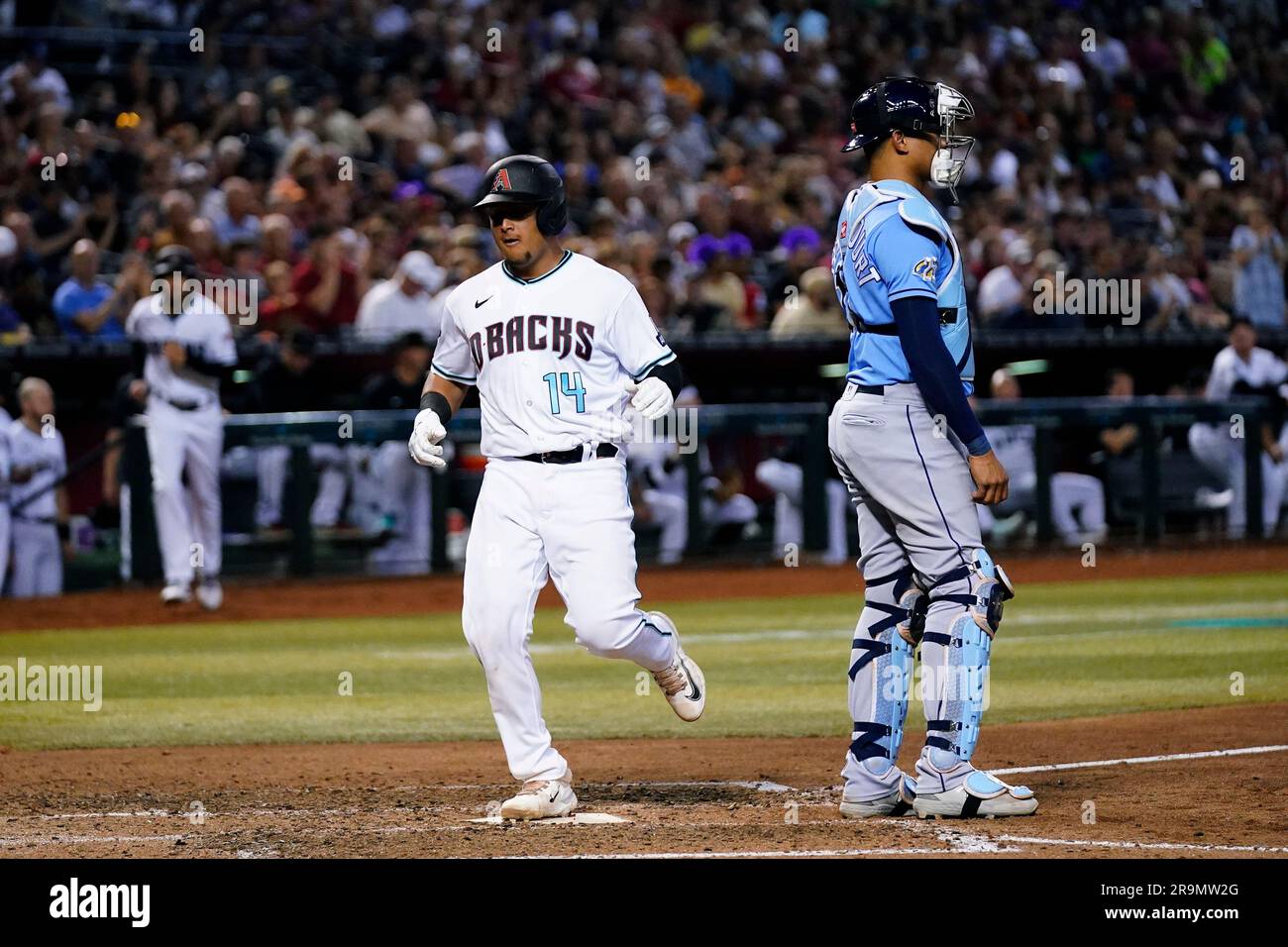 Arizona Diamondbacks' Gabriel Moreno (14) scores a run as Tampa Bay Rays  catcher Christian Bethancourt waits for a possible throw during the sixth  inning of a baseball game Tuesday, June 27, 2023