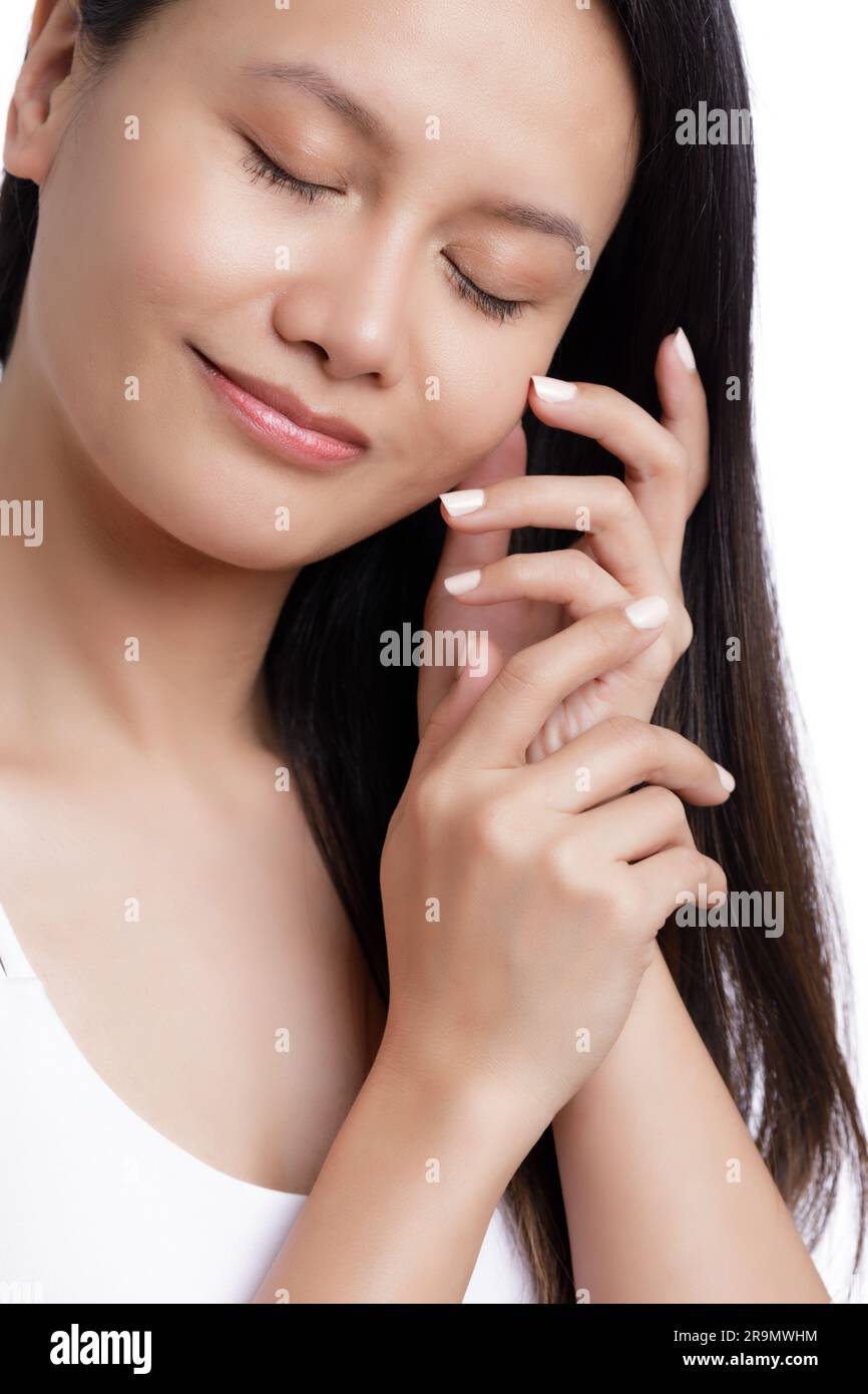 Beautiful hands of an Asian American woman isolated on a white background with copy space Stock Photo