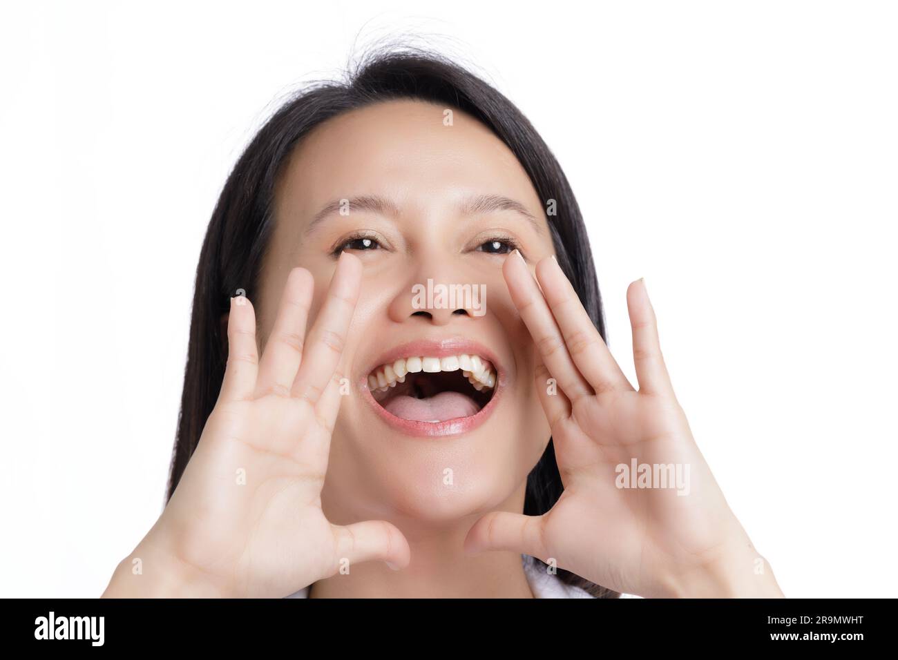 Asian American shouting for joy isolated on a white background with copy space Stock Photo
