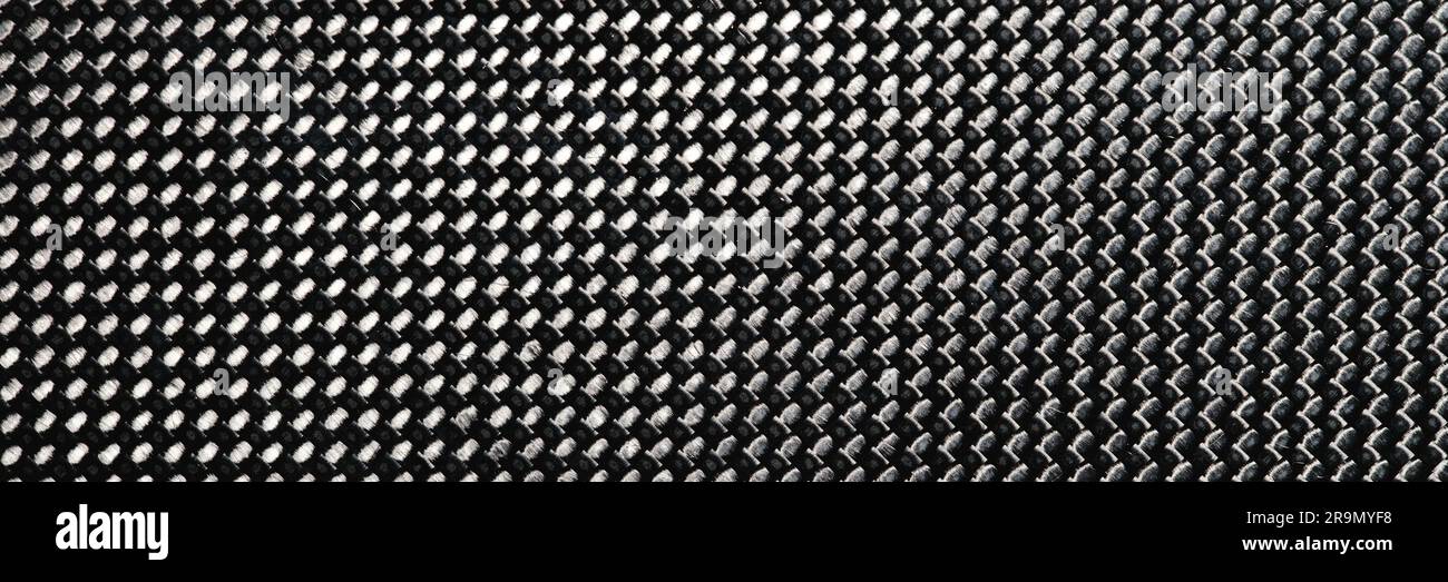 Gray grained carbon fiber background closeup macro Stock Photo