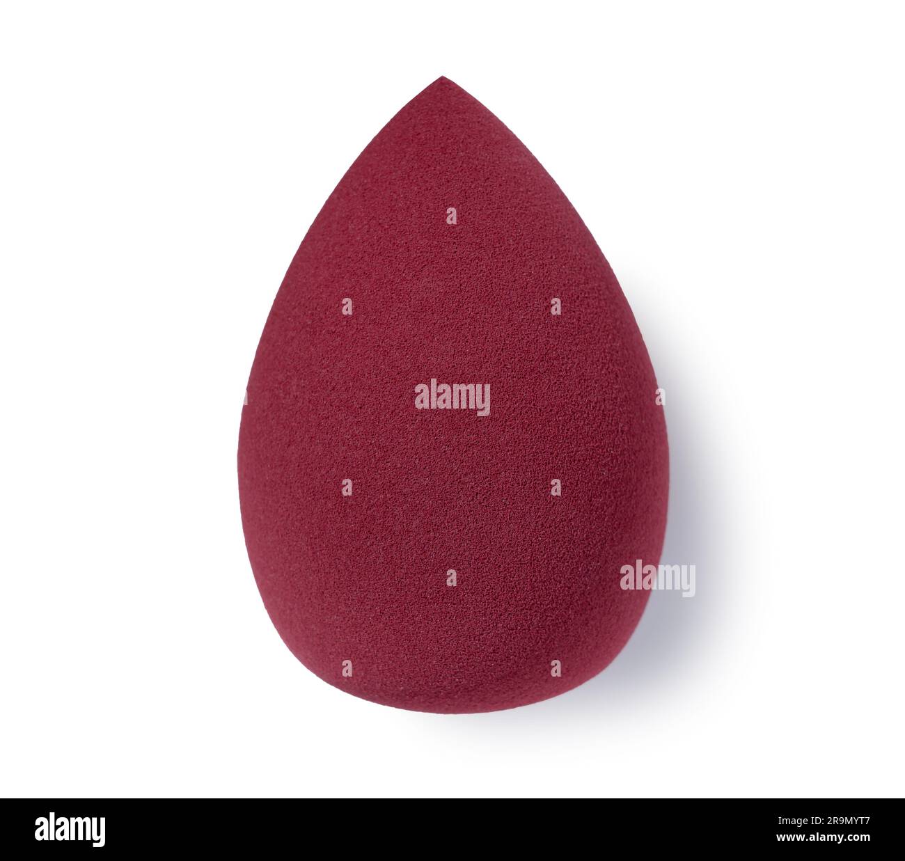 An egg-shaped makeup sponge placed on a white background. Stock Photo
