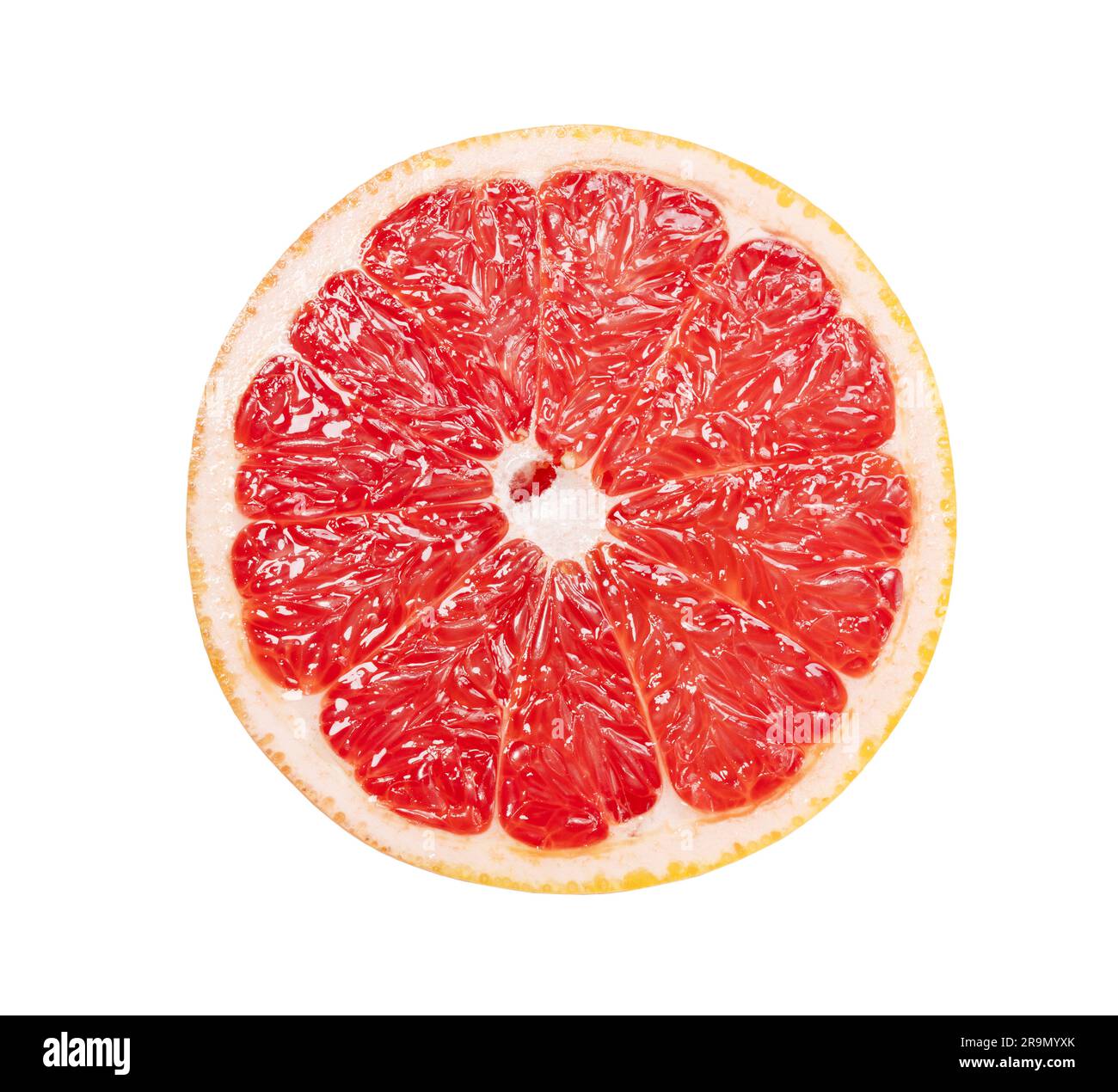 A grapefruit cut in half placed on a white background. Stock Photo