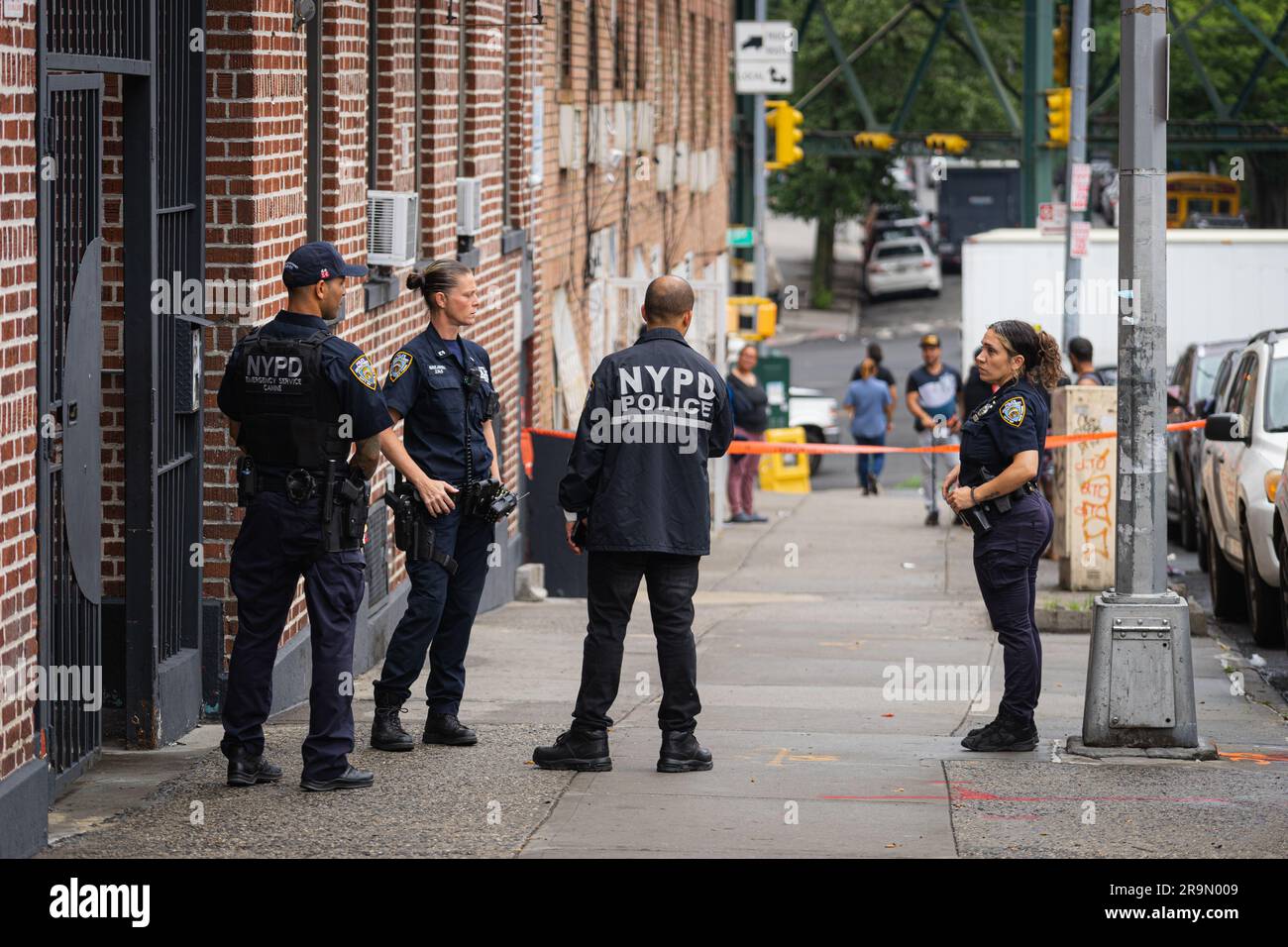 Bronx, USA. 27th June, 2023. Police officers and crime scene detectives