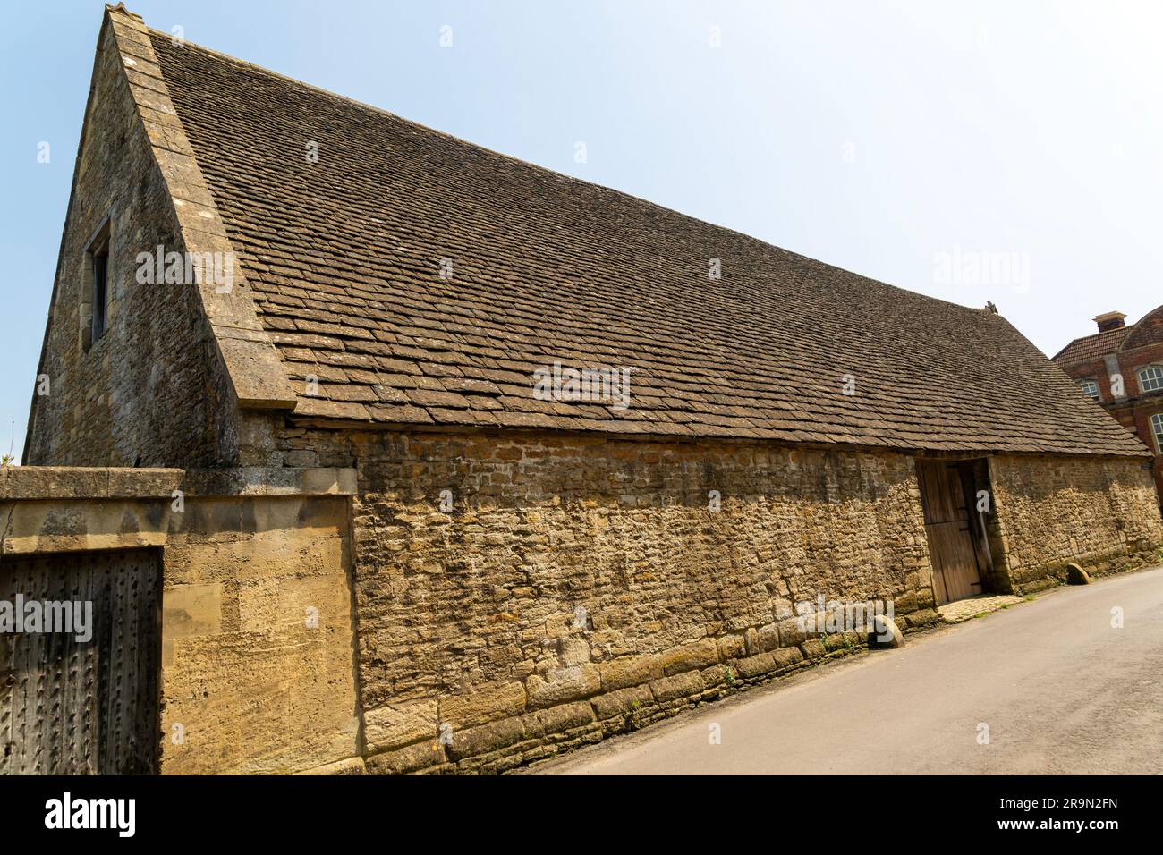 Historic tithe barn in the village of Lacock, Wiltshire, England, UK