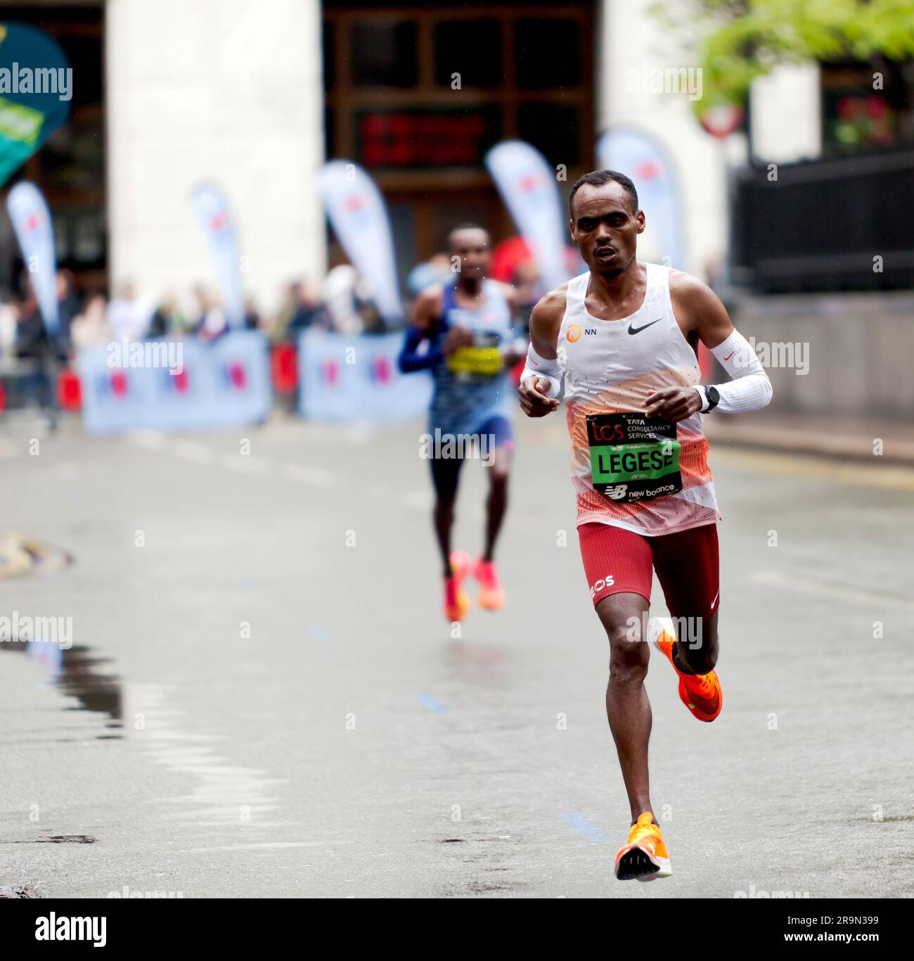 Birhanu Legese (ETH), passing through Cabot Square, during the 2023 London Marathon Stock Photo