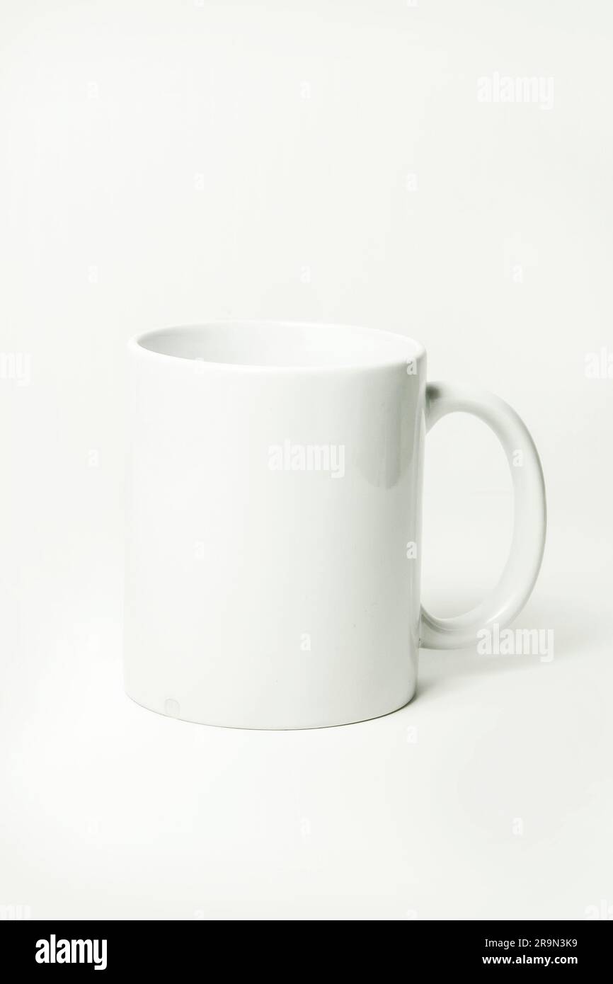 White coffee cup on a white background with copy space for text. Stock Photo