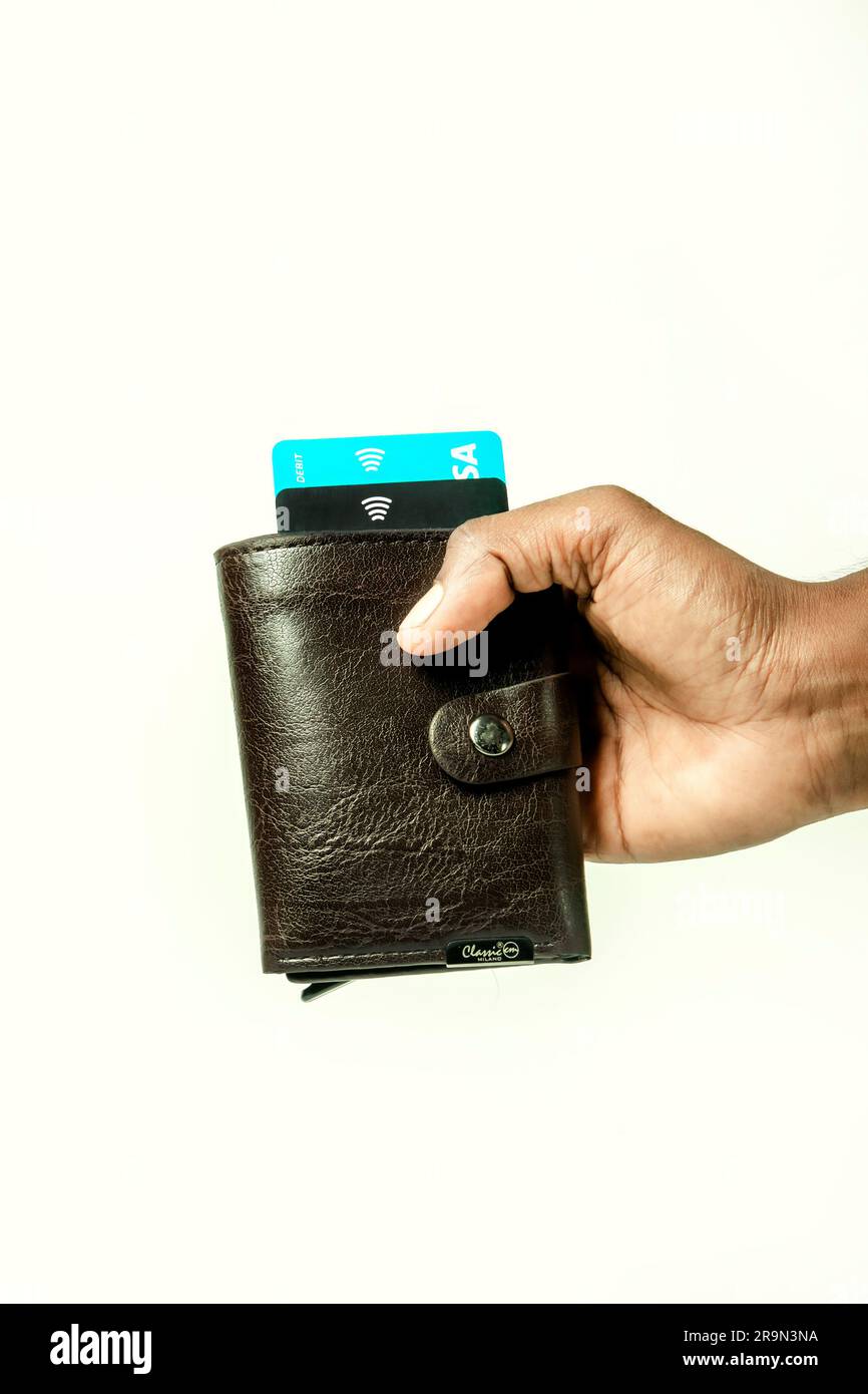 hand holding wallet with credit cards Stock Photo - Alamy