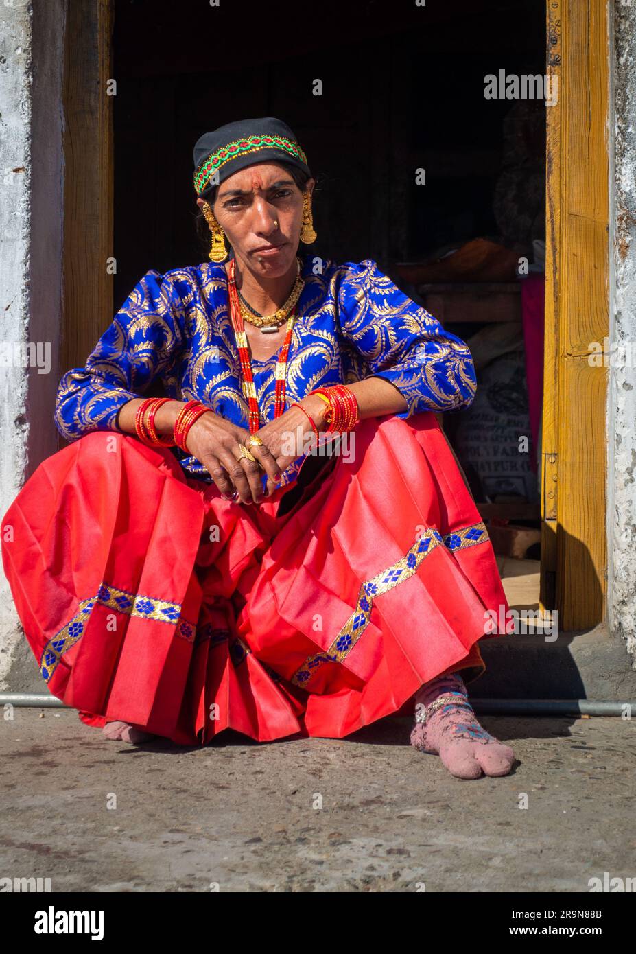 31st January 2023, Tehri Garhwal, Uttarakhand, India. A native garhwali woman dressed in a traditional garhwali attire in a wedding ceremony. Jaunsar- Stock Photo