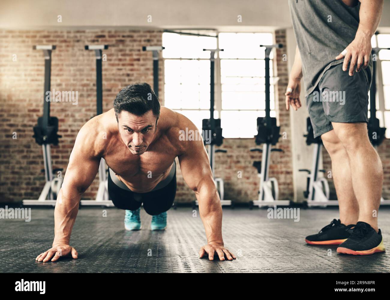 Push up training and man or personal trainer in gym support