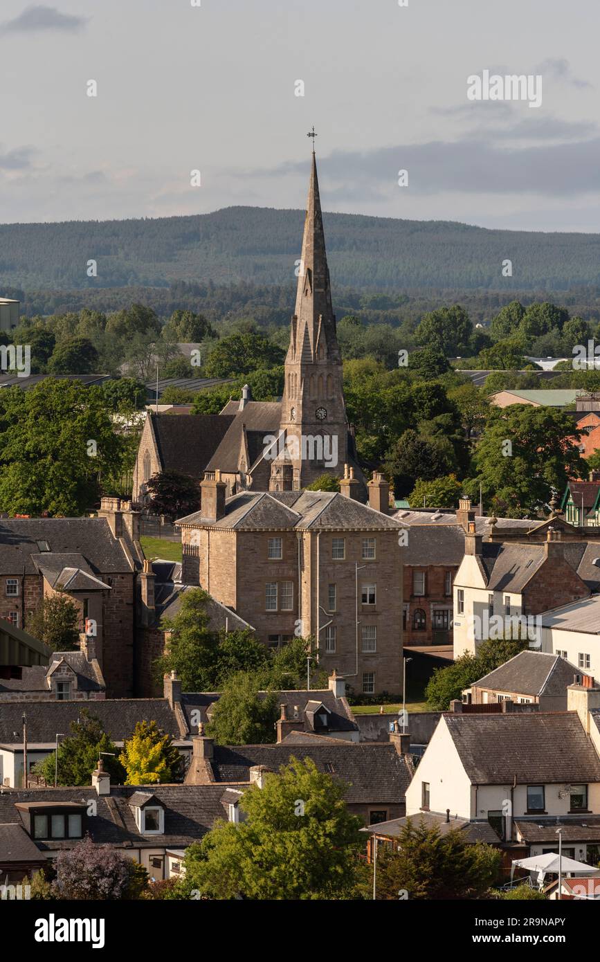 Invergordon, Scotland, UK.  3 June 2023.  The spire of  The Church of Scotland towers above the small coastal town of Ivergordon gateway to The Highlands. Stock Photo