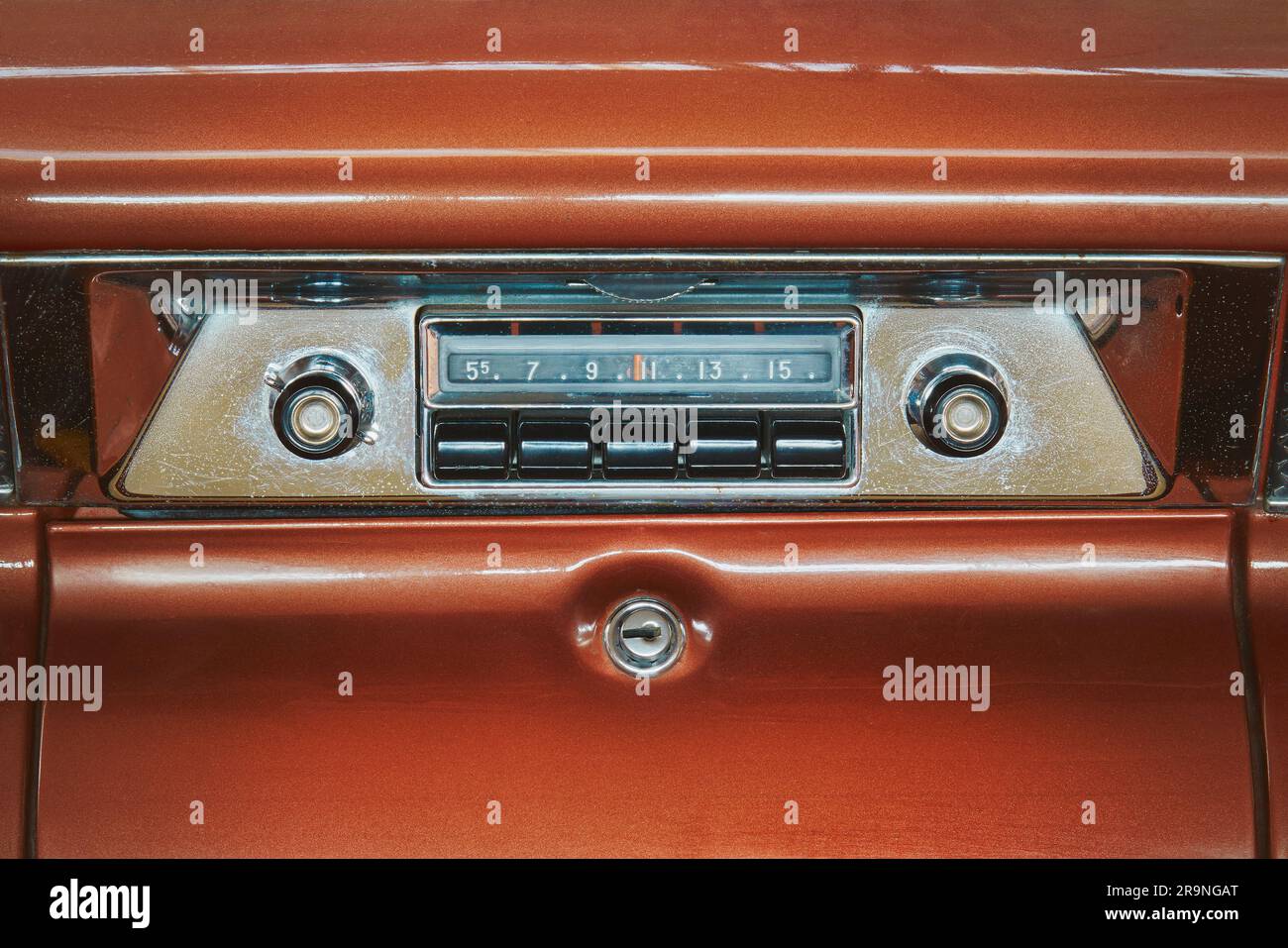 Old car radio inside a red classic American car Stock Photo