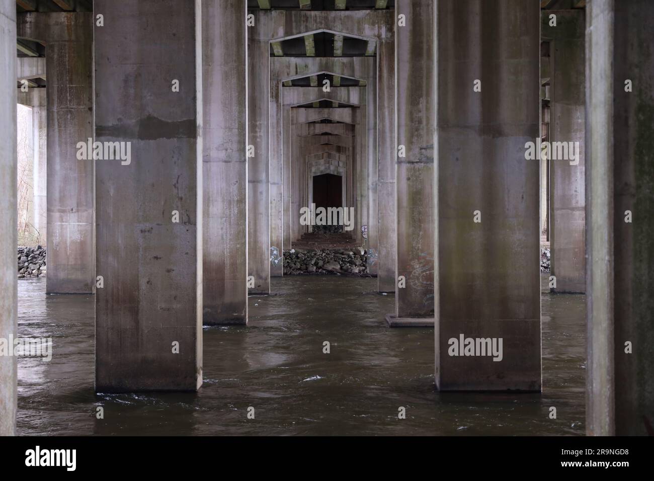 A scenic view of an abandoned corridor featuring an array of columns Stock Photo