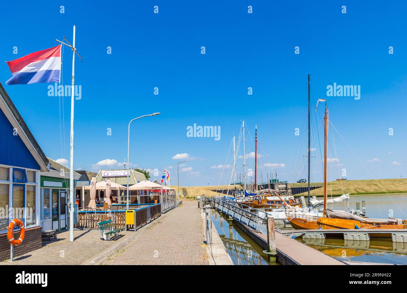 Restaurants and boats in the harbor of Termunterzijl, Netherlands Stock Photo